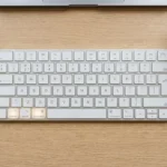 Mac keyboard showing the Control, Command, and Space keys used for the emoji keyboard shortcut